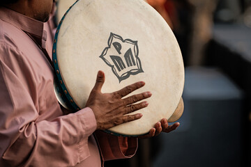 Traditional drum held by musician during performance