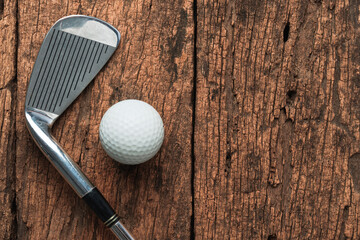 Golf Club with Golf Balls on Wooden Background with copy space.