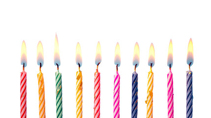 Colorful birthday candles in a row. Flames flicker