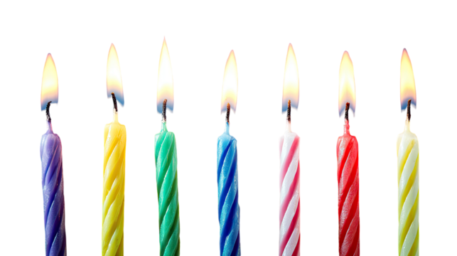 Colorful birthday candles, lit, against black - Powered by Adobe