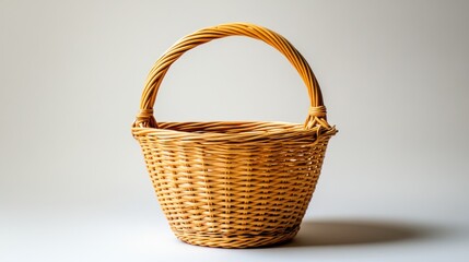 Obraz premium empty wicker basket against white background