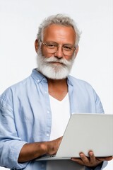 Elderly caucasian male with beard using laptop in light blue shirt