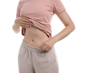 Fototapeta na wymiar Woman with flat belly on white background, closeup