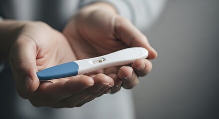 Pregnancy Test Result in Hands.
