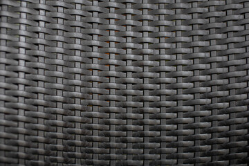 Black plastic woven pattern close-up photo
