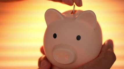 A salaried employee drops a coin into a piggy bank under warm sunlight, symbolizing saving habits, financial planning, discipline, future security, and the importance of building wealth step by step.
