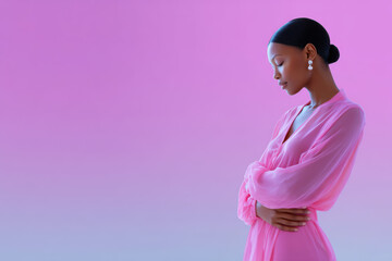 Fashion model posing with crossed arms on gradient background