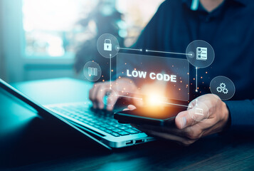 Low code development concept with businessman using laptop and smartphone. Digital interface icons show modern software, automation, app creation, innovation, and IT solutions.