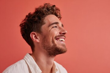 Fototapeta premium Smiling bearded man looking upwards