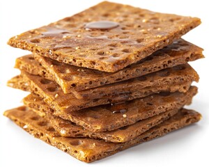 Fototapeta premium Stacked, textured, brown crackers, dripped with shiny golden syrup on white