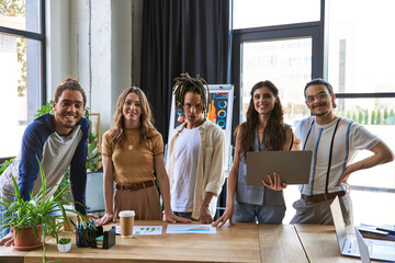 Stylish young coworkers collaborating creatively in a modern office space