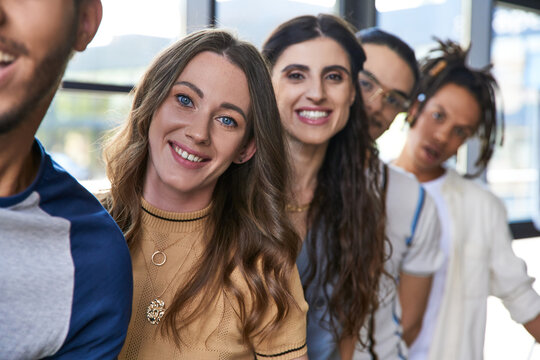 Young stylish coworkers collaborating happily in a modern office setting