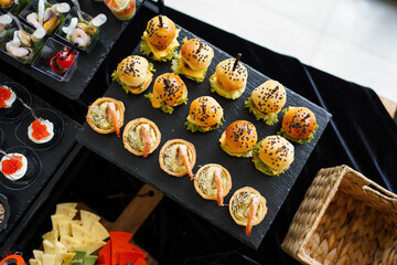 Colorful cheese platter with berries, nuts, dried fruits, and honey.