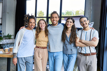 Young stylish coworkers enjoying a vibrant moment in a modern office space together