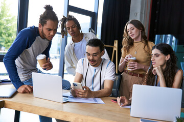 Young stylish coworkers collaborating in a modern coworking space during a productive day