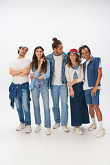 Obraz premium Young stylish friends celebrate fashion and friendship in a vibrant studio setting