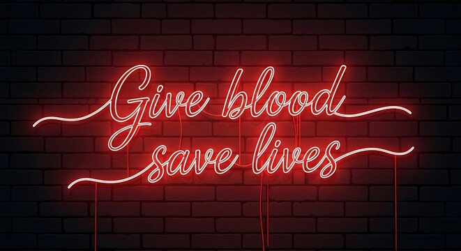 Neon sign with blood donation message against dark brick wall for awareness campaigns