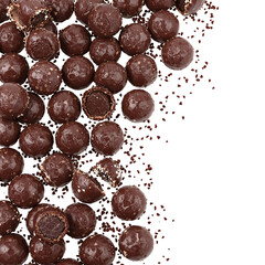 Fototapeta premium Tempting chocolate-coated crunchy snacks scattered artfully, with crumbs spilling onto a pristine white surface, highlighting rich texture and delicious indulgence for confectionery designs