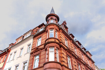 Fototapeta premium Historic Red Brick Building with Turret in Heidelberg Germany