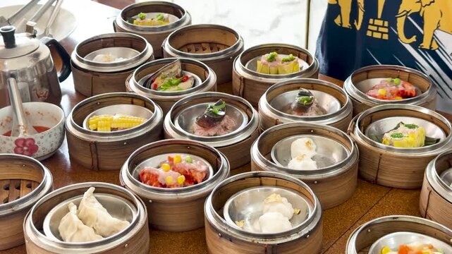 Serving Dim Sum Baskets at a Restaurant Table