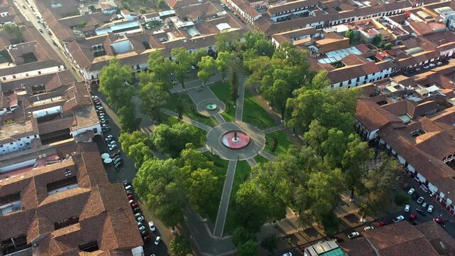 DRONE: FULL ORBIT SHOT OF VASCO DE QUIROGA PLAZA IN PATZCUARO, MICHOACAN AT SUNSET