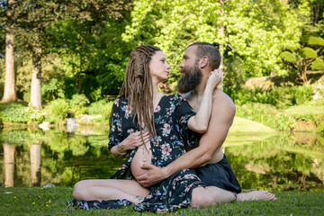 Photography of a lovely young couple expected a baby