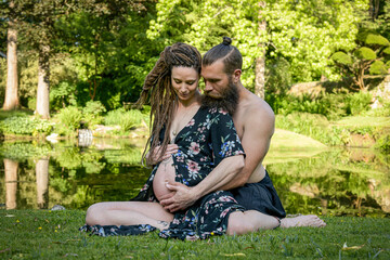 Photography of a lovely young couple expected a baby