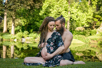 Photography of a lovely young couple expected a baby