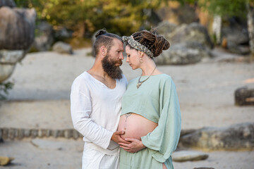 Photography of a lovely young couple expected a baby