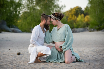 Photography of a lovely young couple expected a baby