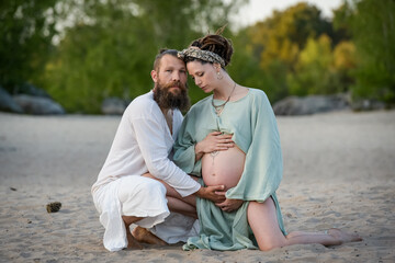 Photography of a lovely young couple expected a baby
