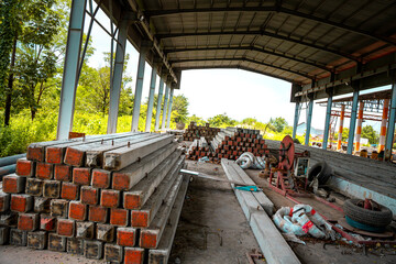 Construction site with cement factory, mixer trucks, and concrete silos