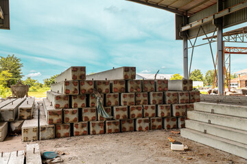 Construction site with cement factory, mixer trucks, and concrete silos