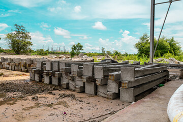 Construction site with cement factory, mixer trucks, and concrete silos