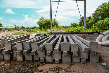 Construction site with cement factory, mixer trucks, and concrete silos