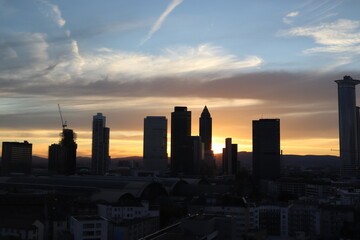 Skyline of downtown Frankfurt, Germany at sunset.
Beautiful sunset against the skyline of Frankfurt financial district. High rises and skyscrapers.