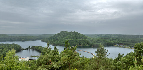 Pontoon bridge in Hoge Kempen National Park for pedestrians and cyclists, connecting the Long Terill and Twin Terills, waste dumps from the ancient coal mine at Eisden