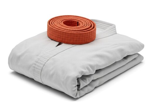 a karate gi white folded colored belt rolled