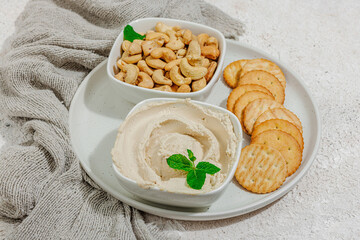 Homemade vegan cashew cheese. Raw healthy sauce in a bowl, lactose free food. Bio organic product