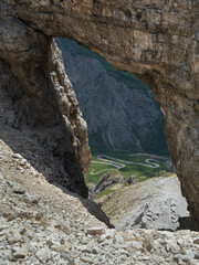 A High Mountain Pass Overlooking A Valley In The Dolomites, Italy