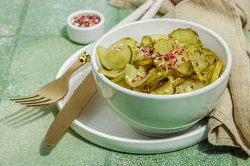 Fermented cucumbers in a bowl. Healthy gut food, natural probiotic superfoods, organic pickles