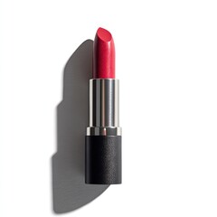 Obraz premium Single lipstick tube, matte black casing, vibrant crimson bullet, cast shadow on white background