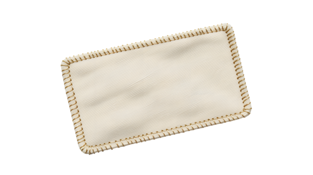 Elegant ivory placemat with a textured surface and decorative edge for upscale dining decor