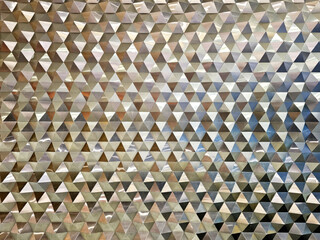 Reflective Geometric Triangle Pattern Wall Texture or Modern Metallic Triangular Facade Background.