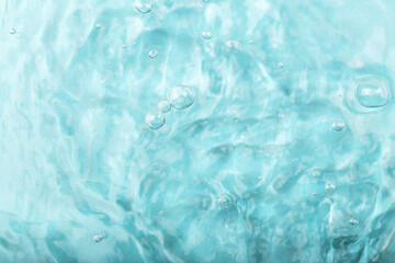 Blue water background with gentle ripples and bubbles, creating serene and tranquil ambiance, ideal for various design projects and visual storytelling