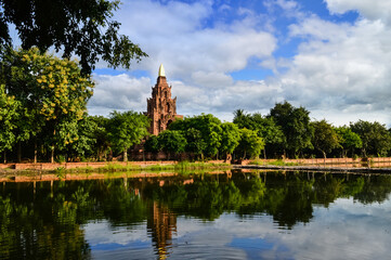 Naklejka premium Old Terracotta Pagoda Lanna Architecture, Symbols of Buddhism, South East Asia at The Terracotta Architecture Garden Lamphun, Northern Thailand.