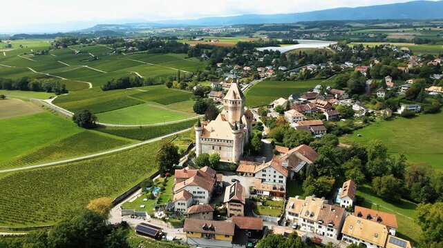 Aerial view of the Ch&acirc;teau de Vufflens and surrounding vineyards, where terracotta rooftops meet lush greenery, Vufflens-le-Ch&acirc;teau, Vaud, Switzerland.