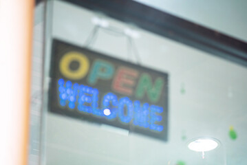 Colorful Welcome Sign in Storefront Window