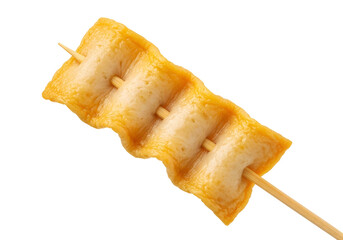 Close-up of a single skewered piece of golden-brown, crispy fish cake, highlighting its textured surface and light golden hue against a pure black backdrop.