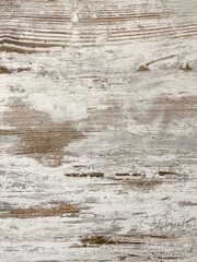 Distressed wood panel with whitewashed texture evokes rustic charm, age, and natural imperfection
